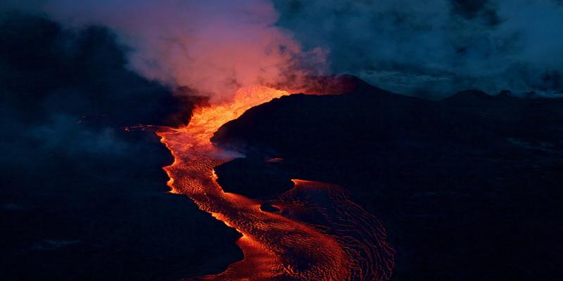 A lava flowing into a mountain

Description automatically generated