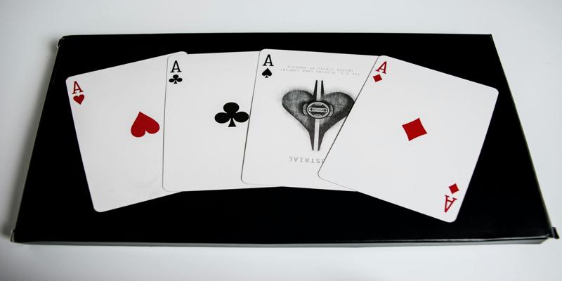 A close-up of playing cards

Description automatically generated