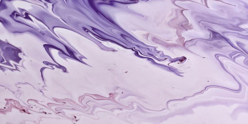 A close up of purple and white paint

Description automatically generated